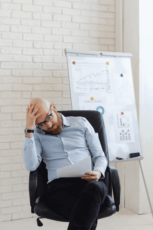 Finance manager reviewing printed performance charts